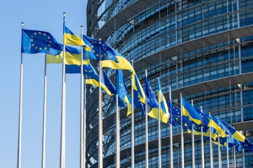 Ukrainian flags in front of the European Parliament building.