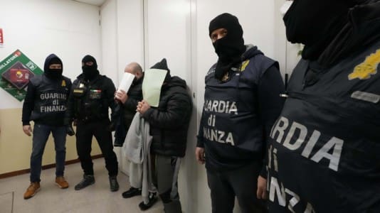Italian police, migrants